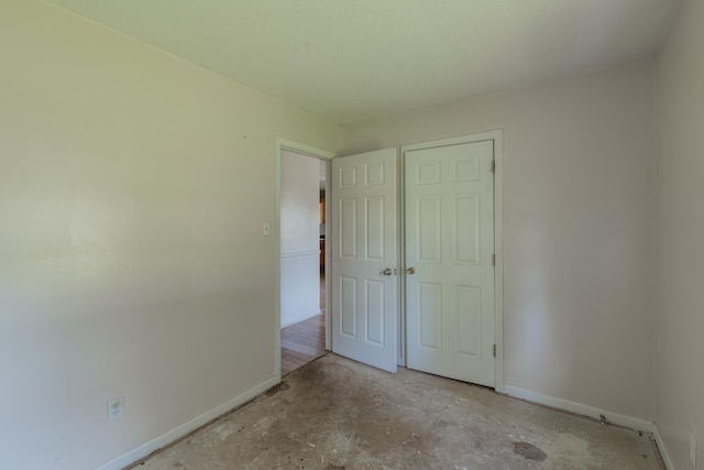 unfurnished bedroom with a closet