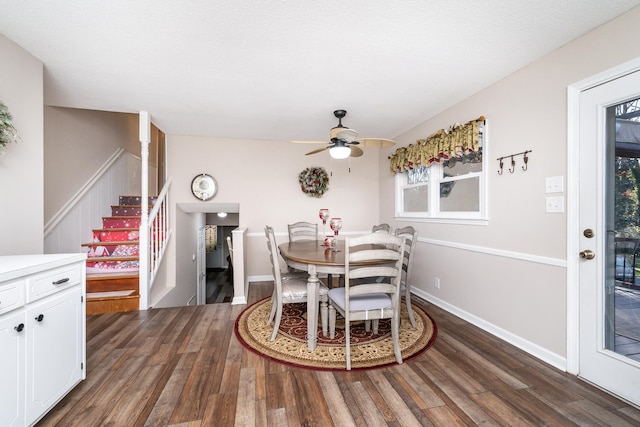 dining area featuring ceiling fan and dark hardwood / wood-style flooring