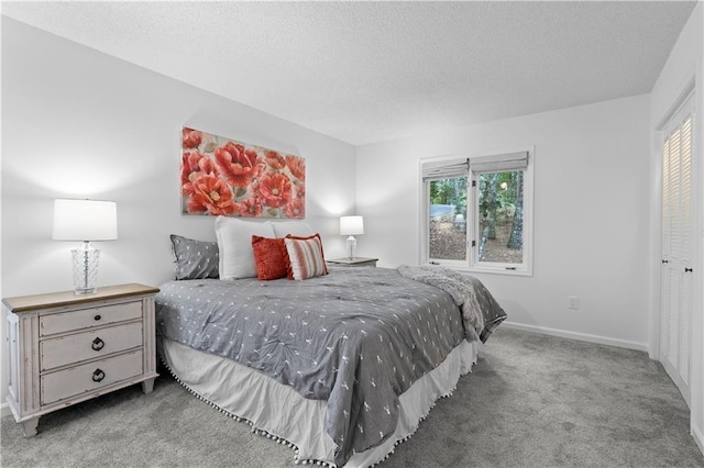 bedroom with light colored carpet, a textured ceiling, and a closet