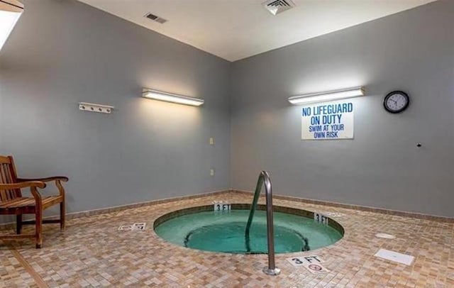 view of pool featuring an indoor hot tub