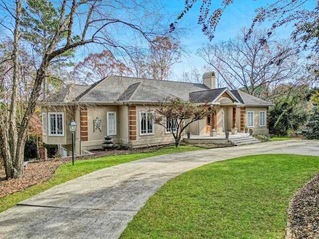 view of front of home with a front lawn