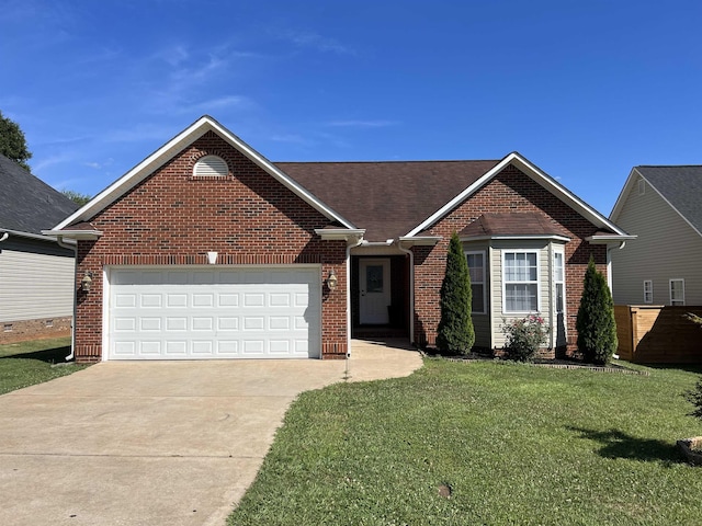 view of front facade with a garage and a front yard