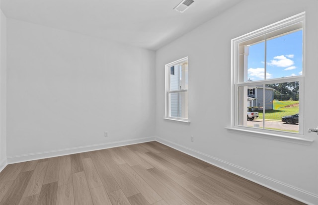 unfurnished room with light hardwood / wood-style flooring