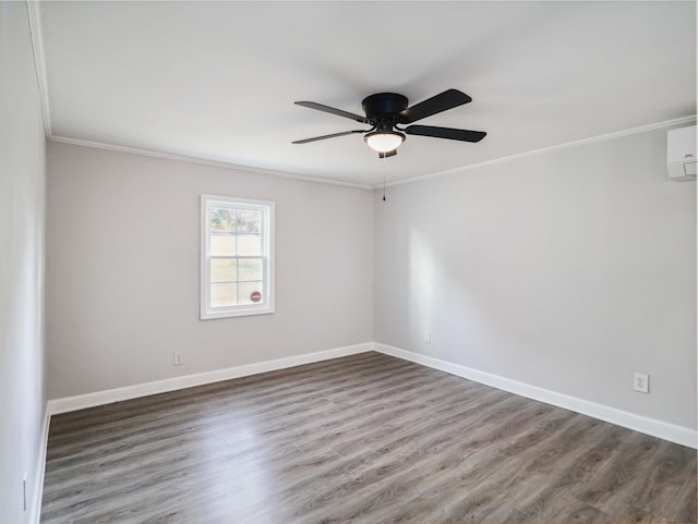 unfurnished room with hardwood / wood-style floors, ceiling fan, and crown molding