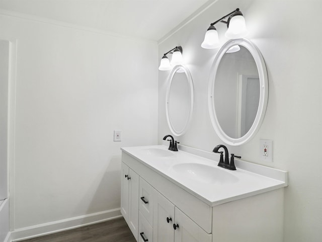 bathroom featuring vanity and hardwood / wood-style flooring