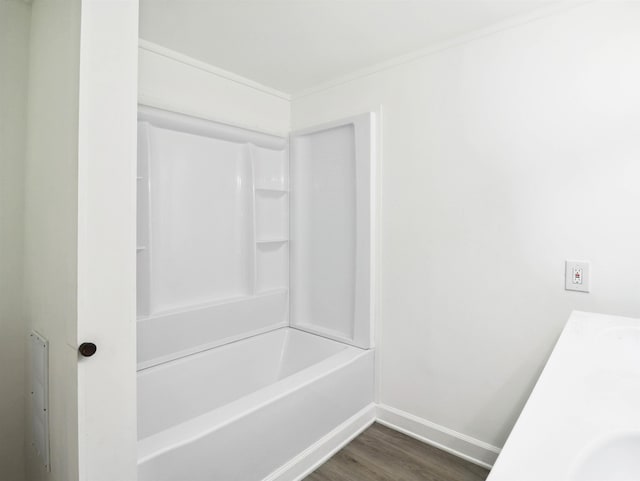 bathroom with vanity, wood-type flooring, and  shower combination