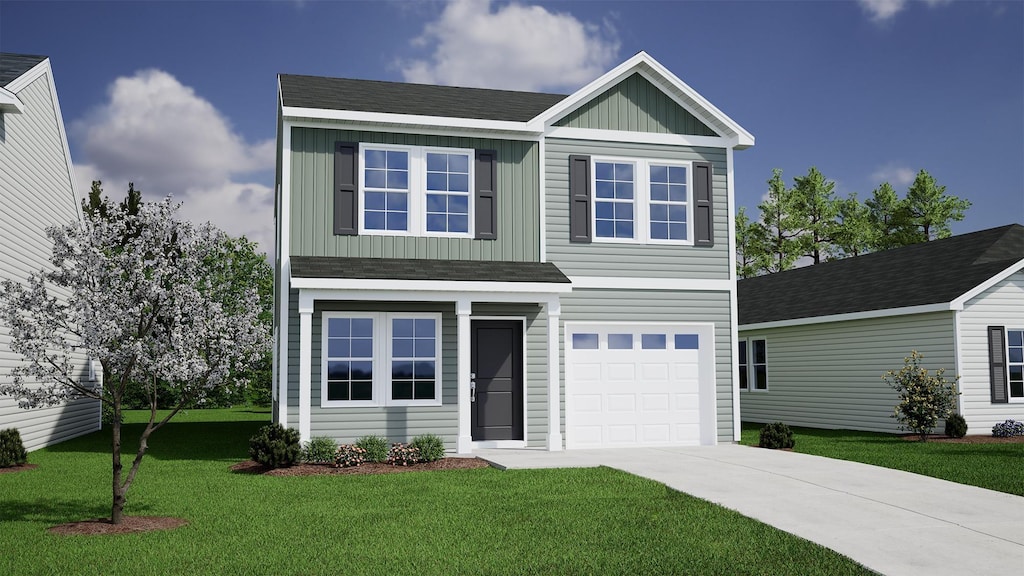 view of front of property featuring a front yard and a garage