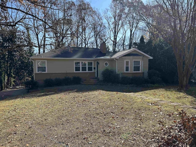 single story home featuring a front yard