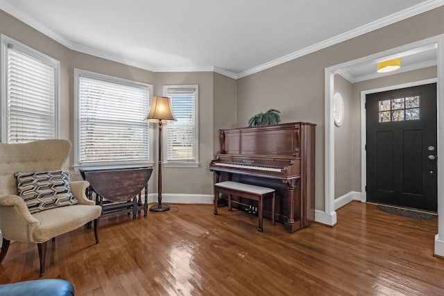 sitting room featuring crown molding and dark wood-type flooring