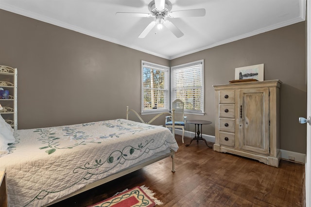 bedroom with dark hardwood / wood-style floors, ceiling fan, and ornamental molding