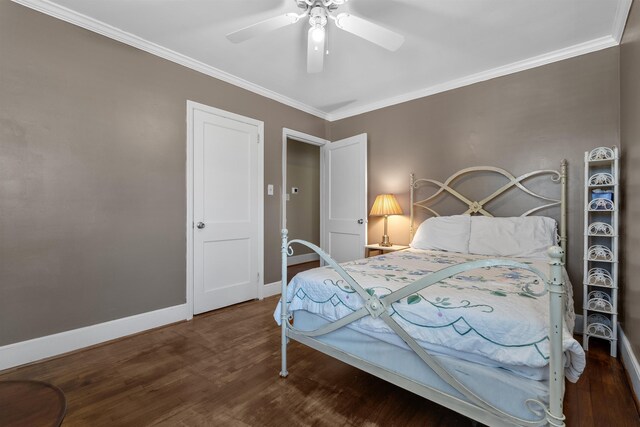 bedroom featuring ceiling fan, dark hardwood / wood-style floors, and ornamental molding