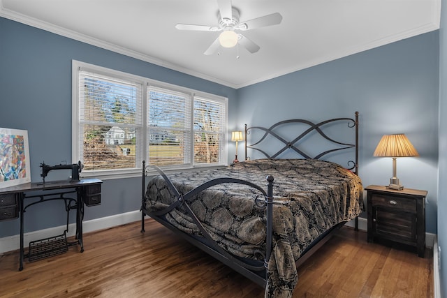 bedroom with hardwood / wood-style flooring, ceiling fan, and ornamental molding