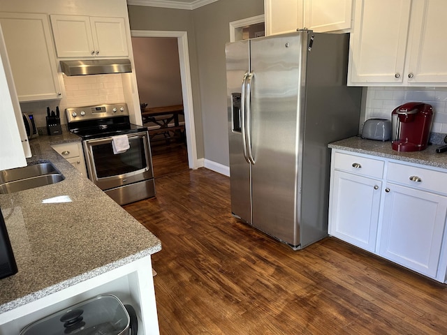 kitchen featuring backsplash, ornamental molding, dark hardwood / wood-style flooring, white cabinetry, and stainless steel appliances