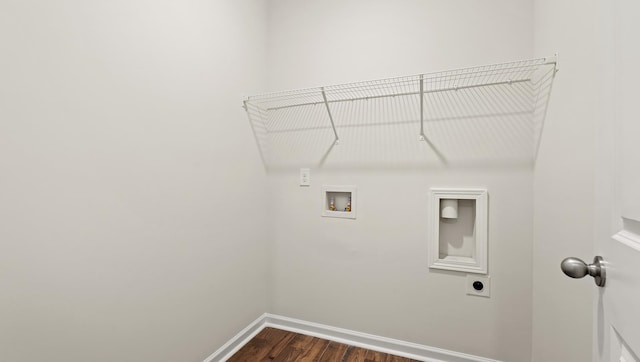 clothes washing area with hookup for an electric dryer, hookup for a washing machine, and dark hardwood / wood-style flooring