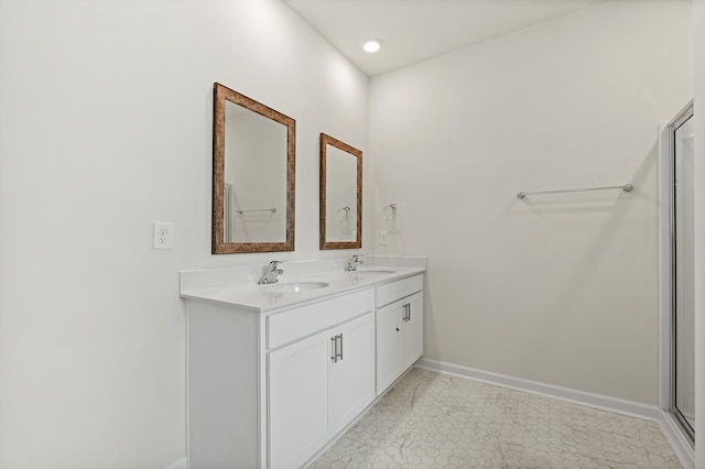 bathroom with tile patterned flooring and vanity