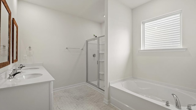 bathroom featuring tile patterned flooring, shower with separate bathtub, and vanity