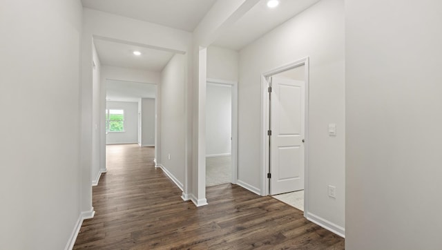 hallway featuring dark wood-type flooring