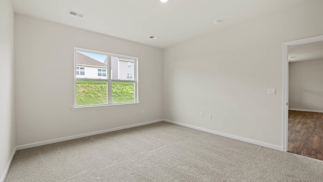 spare room featuring dark hardwood / wood-style floors