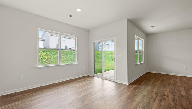 interior space with plenty of natural light and dark wood-type flooring