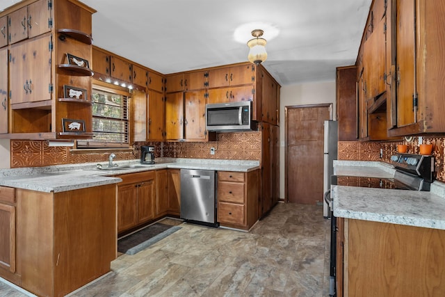 kitchen featuring brown cabinets, appliances with stainless steel finishes, and open shelves