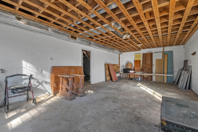 interior space with concrete block wall