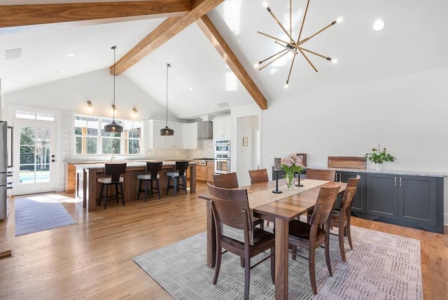 dining room with beam ceiling, sink, an inviting chandelier, high vaulted ceiling, and light wood-type flooring