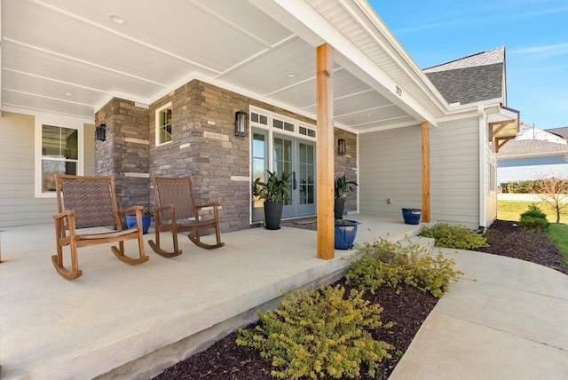 view of patio / terrace featuring covered porch and french doors