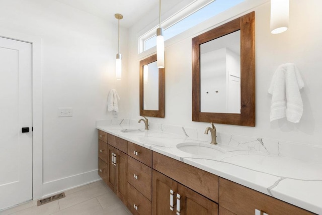 bathroom with tile patterned flooring and vanity