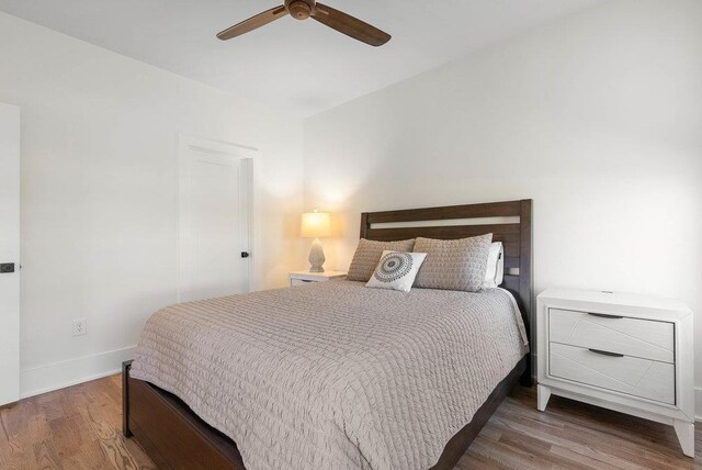 bedroom featuring ceiling fan and hardwood / wood-style floors