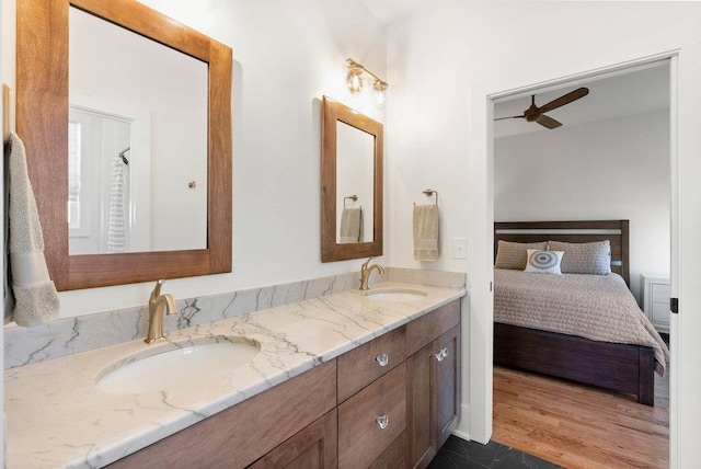 bathroom featuring vanity, hardwood / wood-style flooring, and ceiling fan