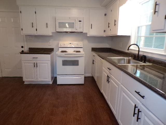 kitchen with sink, white cabinets, dark wood-type flooring, and white appliances