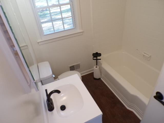 bathroom featuring toilet and sink