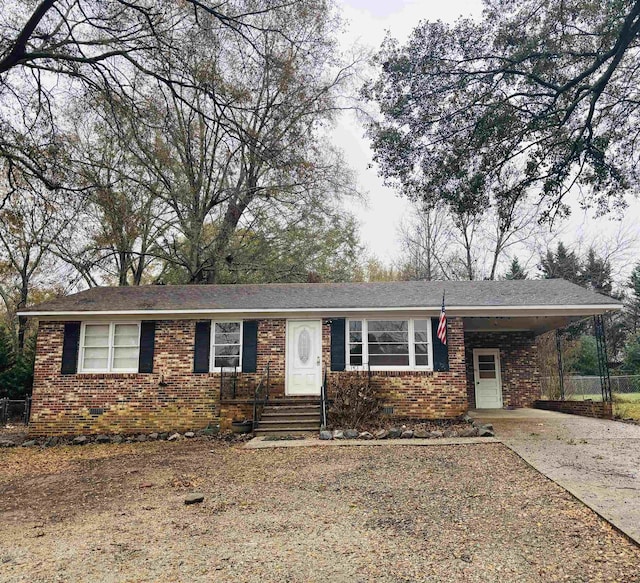 ranch-style home with a carport