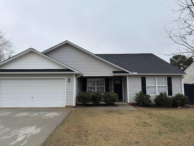 ranch-style house with a garage and a front yard