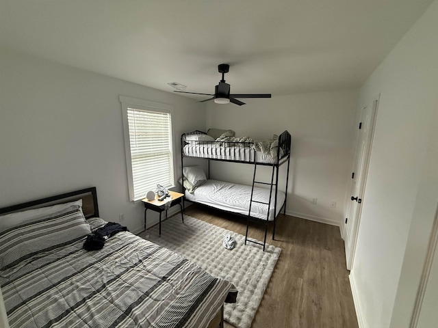 bedroom featuring ceiling fan and hardwood / wood-style flooring