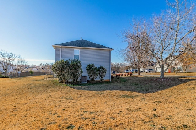 view of property exterior with a yard