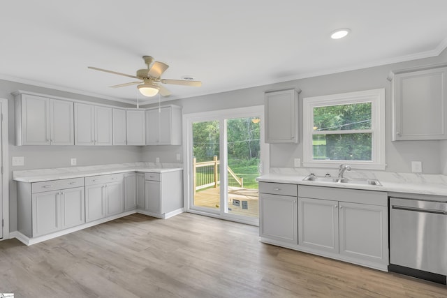 kitchen with light hardwood / wood-style floors, dishwasher, a healthy amount of sunlight, and sink