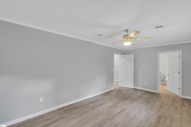 spare room featuring ceiling fan, crown molding, and light hardwood / wood-style flooring