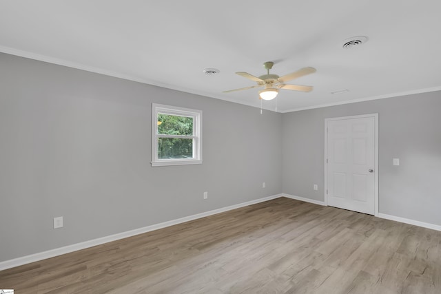 empty room with light wood-type flooring, ceiling fan, and ornamental molding