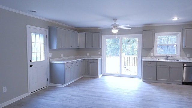 kitchen featuring light wood-type flooring, gray cabinetry, and sink