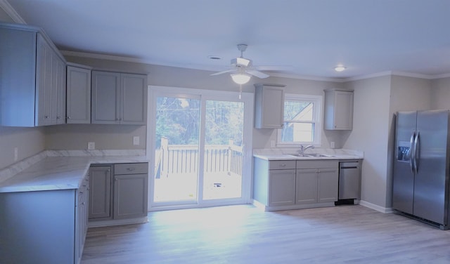 kitchen featuring gray cabinetry, light hardwood / wood-style floors, sink, and stainless steel refrigerator with ice dispenser