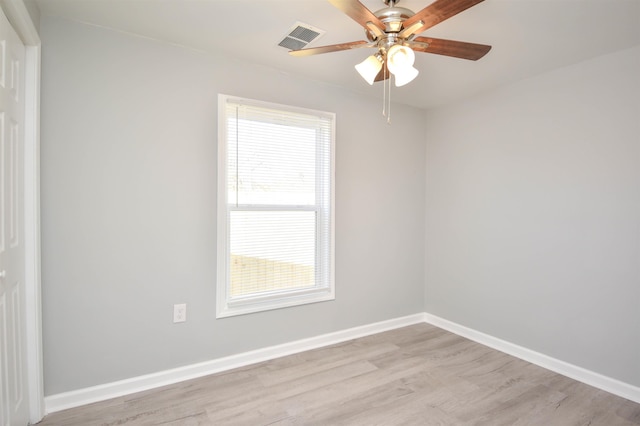 unfurnished room featuring plenty of natural light, light hardwood / wood-style floors, and ceiling fan