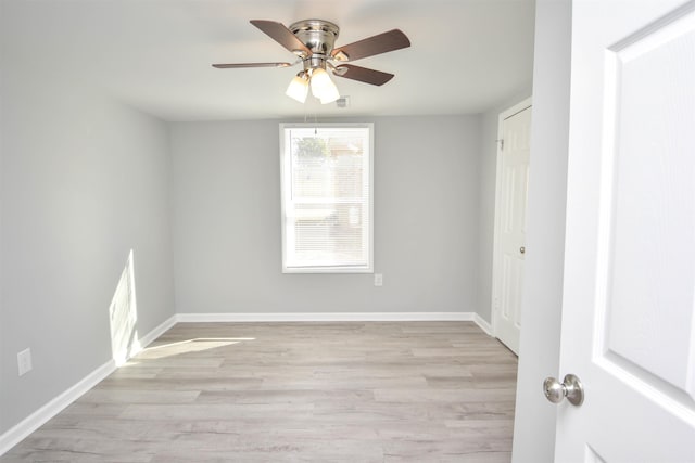 empty room with light hardwood / wood-style floors and ceiling fan