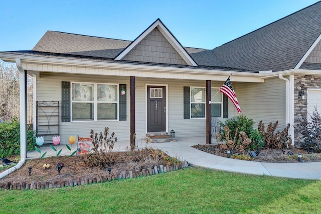 view of front of home featuring a porch and a front lawn