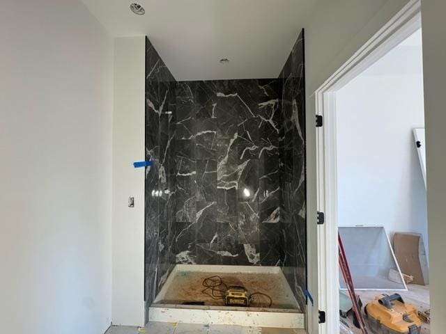 bathroom with tile walls