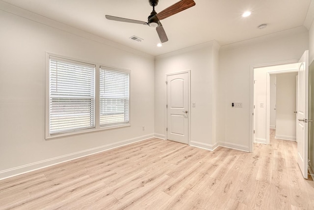 unfurnished room featuring ceiling fan, ornamental molding, and light hardwood / wood-style flooring