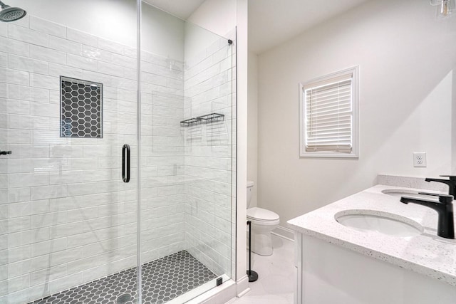 bathroom with vanity, toilet, and an enclosed shower