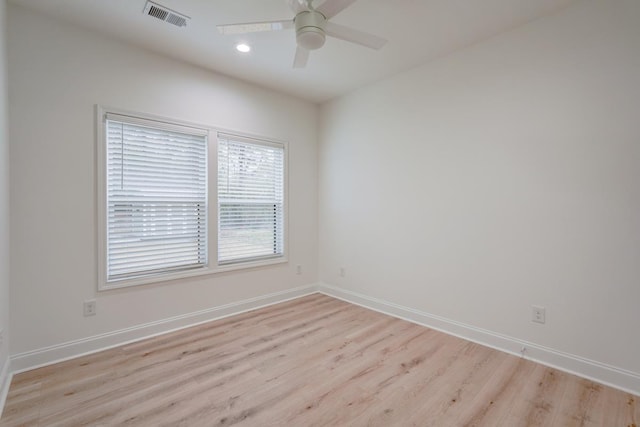 spare room with light hardwood / wood-style flooring and ceiling fan