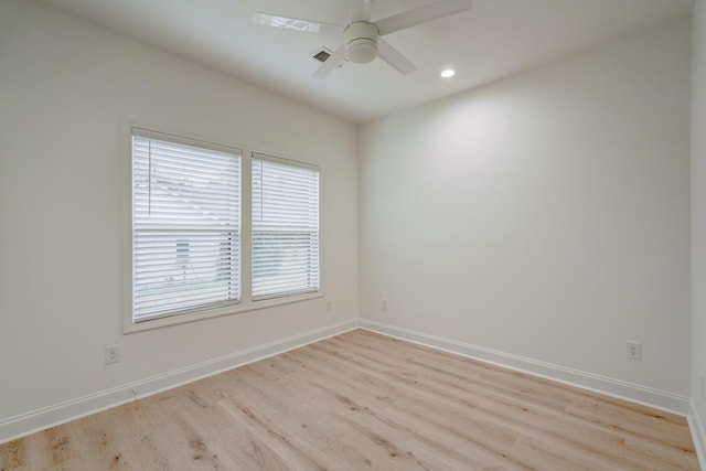 empty room with light wood-type flooring and ceiling fan