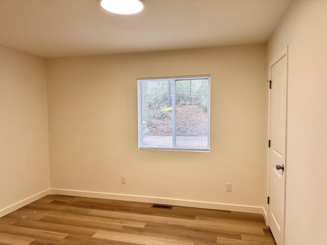 unfurnished room featuring wood-type flooring